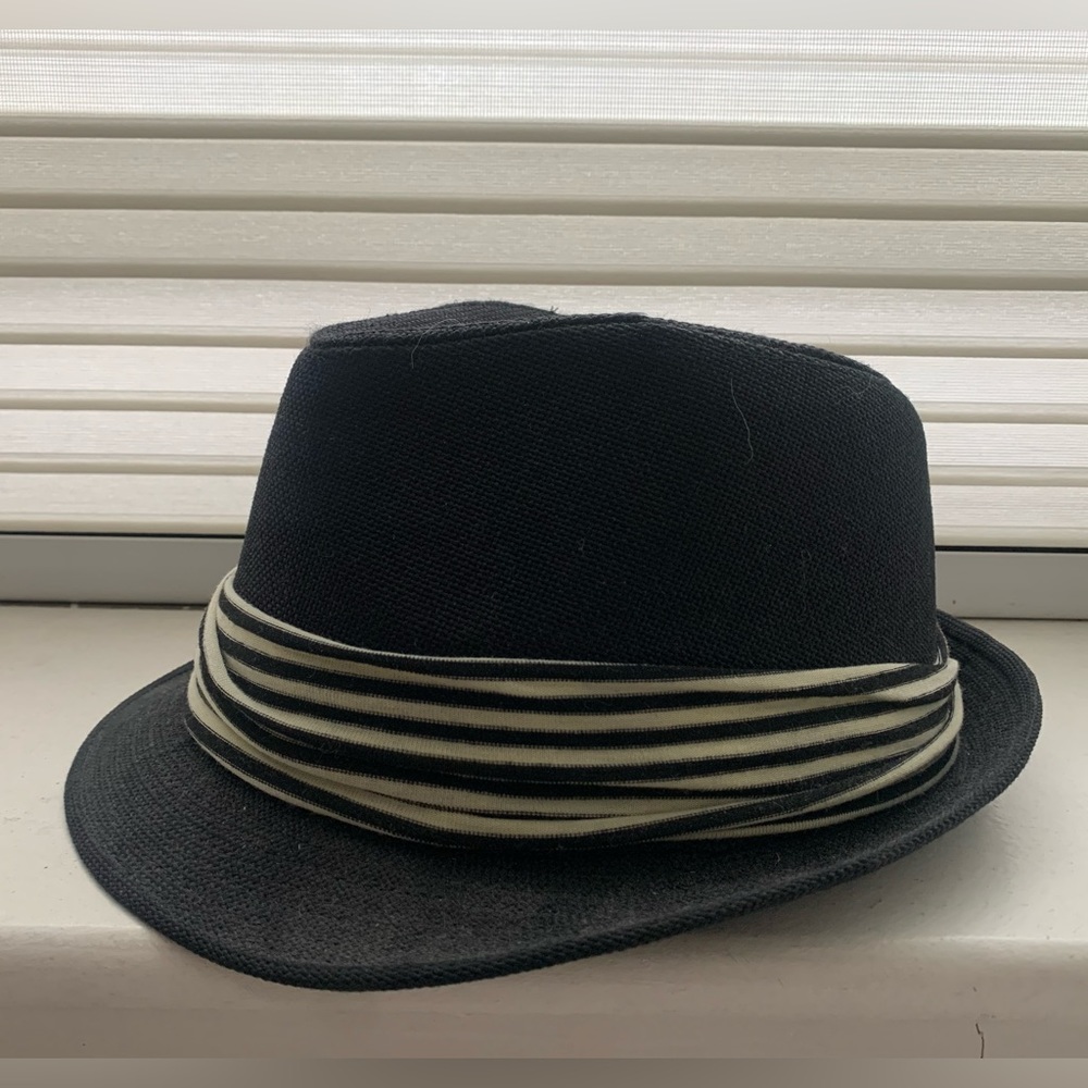 Black fedora with black and white strip band